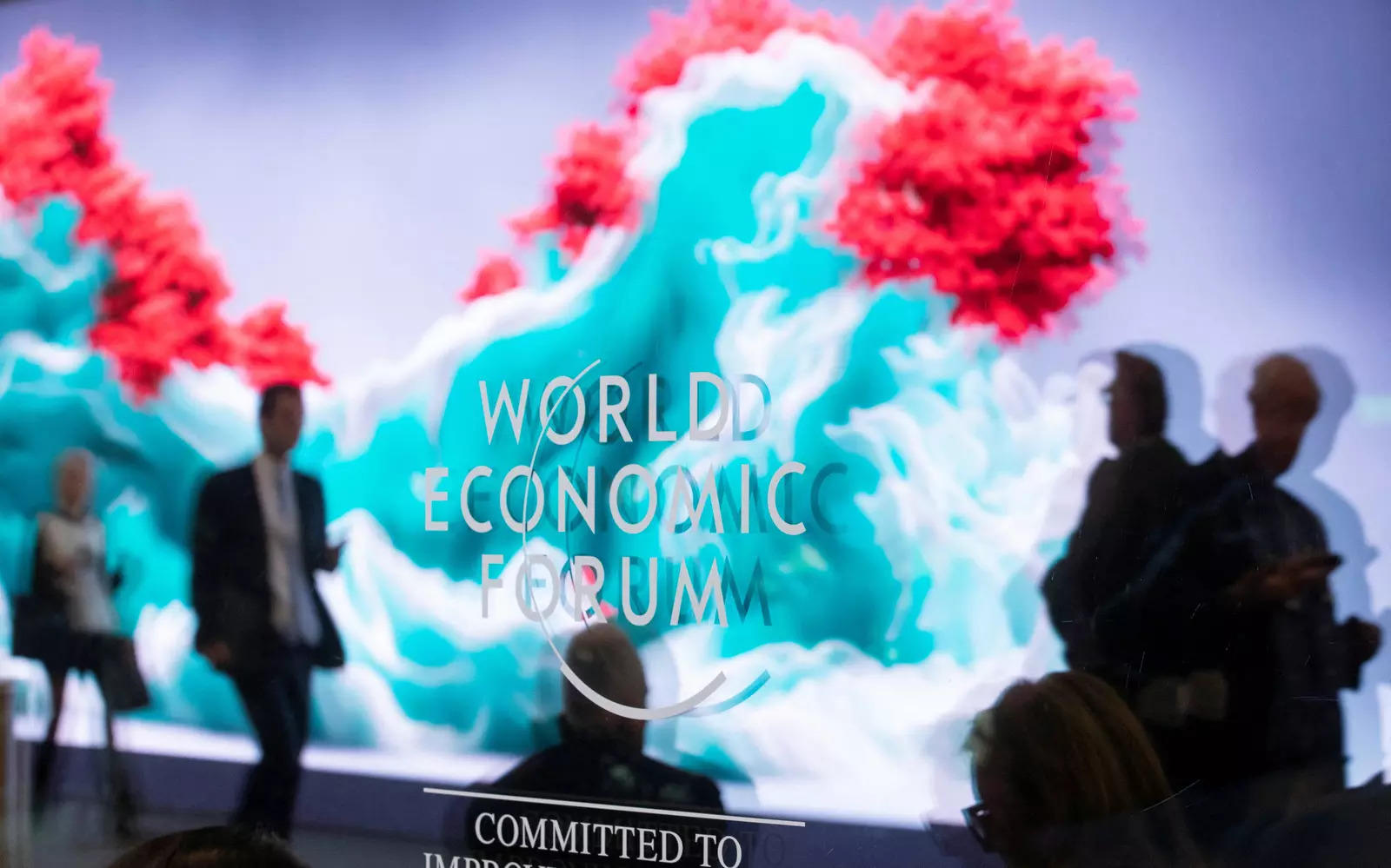  The data sculpture &quot;Artificial Realities: Coral&quot; by Turkish-born artist Refik Anadol is reflected in a window at Davos Congress Centre, the venue of the World Economic Forum (WEF) 2023, in the Alpine resort of Davos, Switzerland, January 17, 2023. REUTERS/Arnd Wiegmann