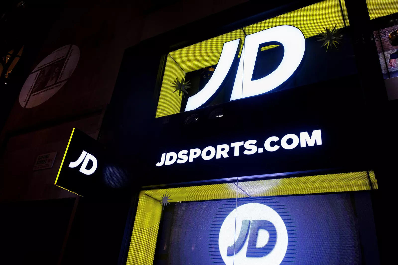  FILE PHOTO: JD Sports logo is seen on the exterior of a store in London, Britain, November 17, 2021. Picture taken November 17, 2021. REUTERS/May James