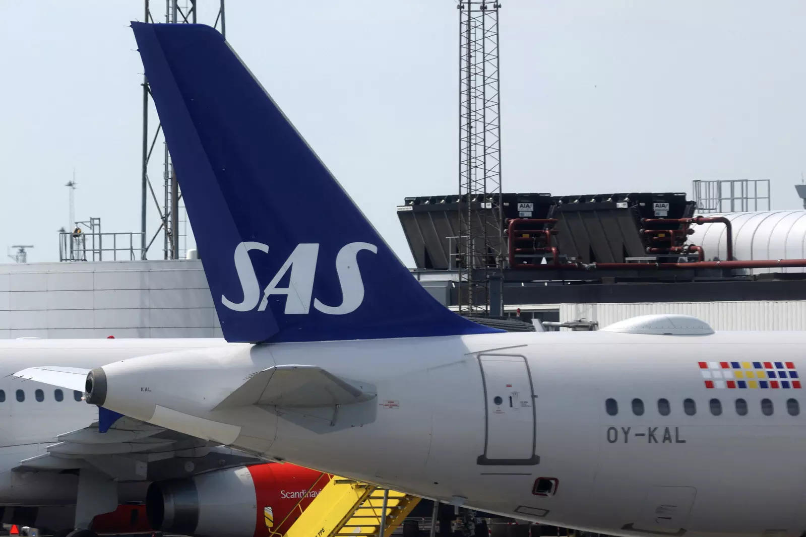  FILE PHOTO: The tail fin of a parked Scandinavian Airlines (SAS) airplane is seen on the tarmac at Copenhagen Airport Kastrup in Copenhagen, Denmark, July 3, 2022. REUTERS/Andrew Kelly